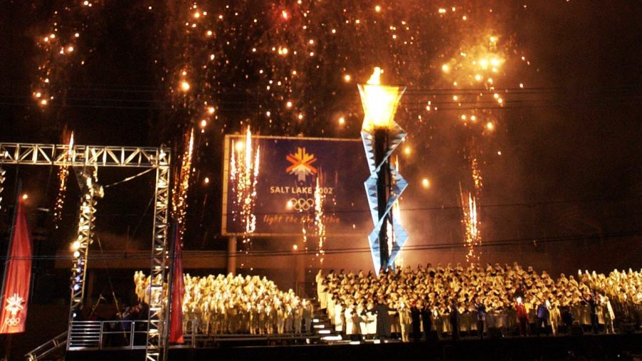 FILE - The then named Mormon Tabernacle Choir, surrounded by "The Children of Light" sing as firewo...