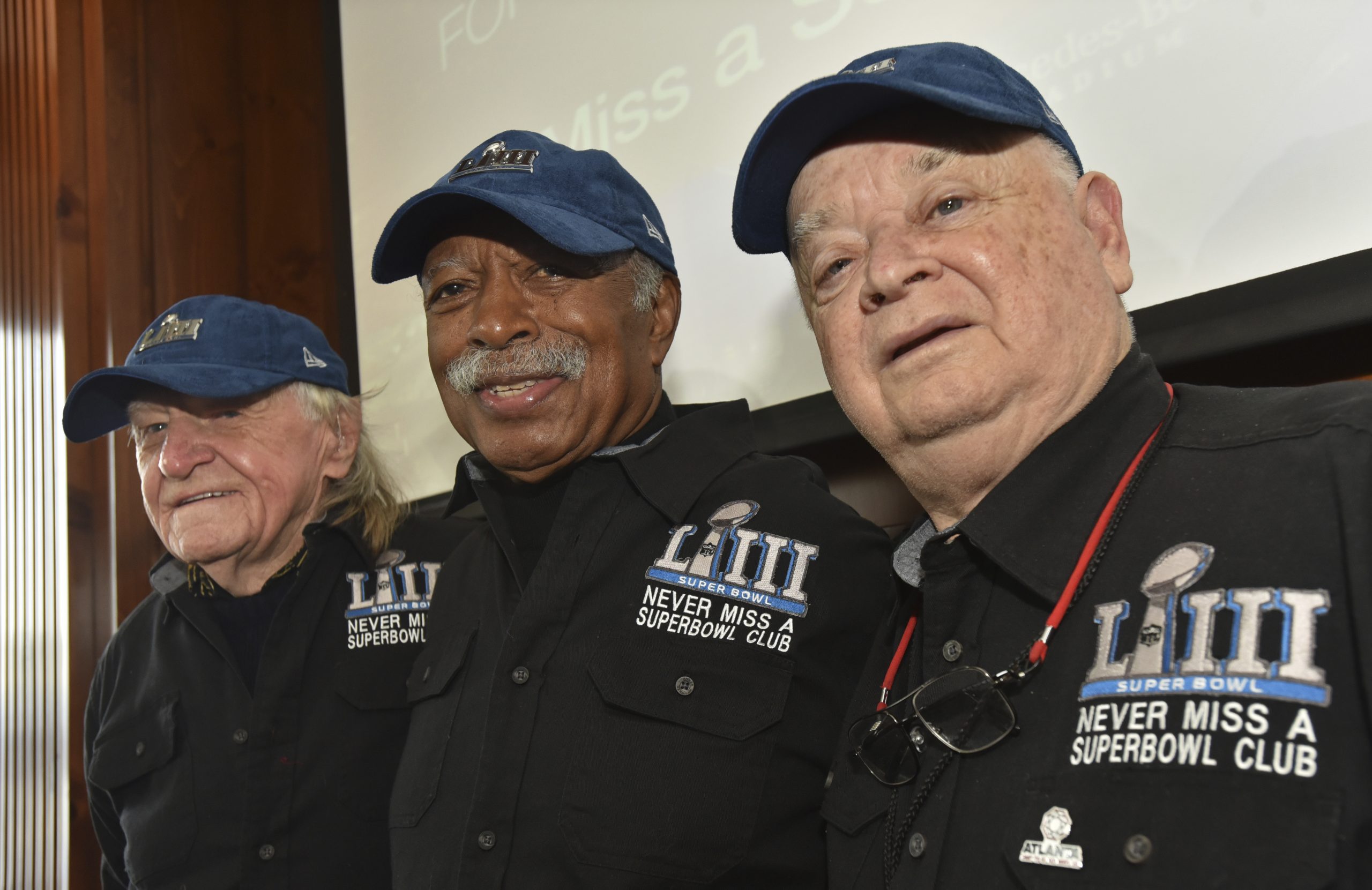 FILE — Members of the Never Miss a Super Bowl Club, from the left, Tom Henschel, Gregory Eaton, a...