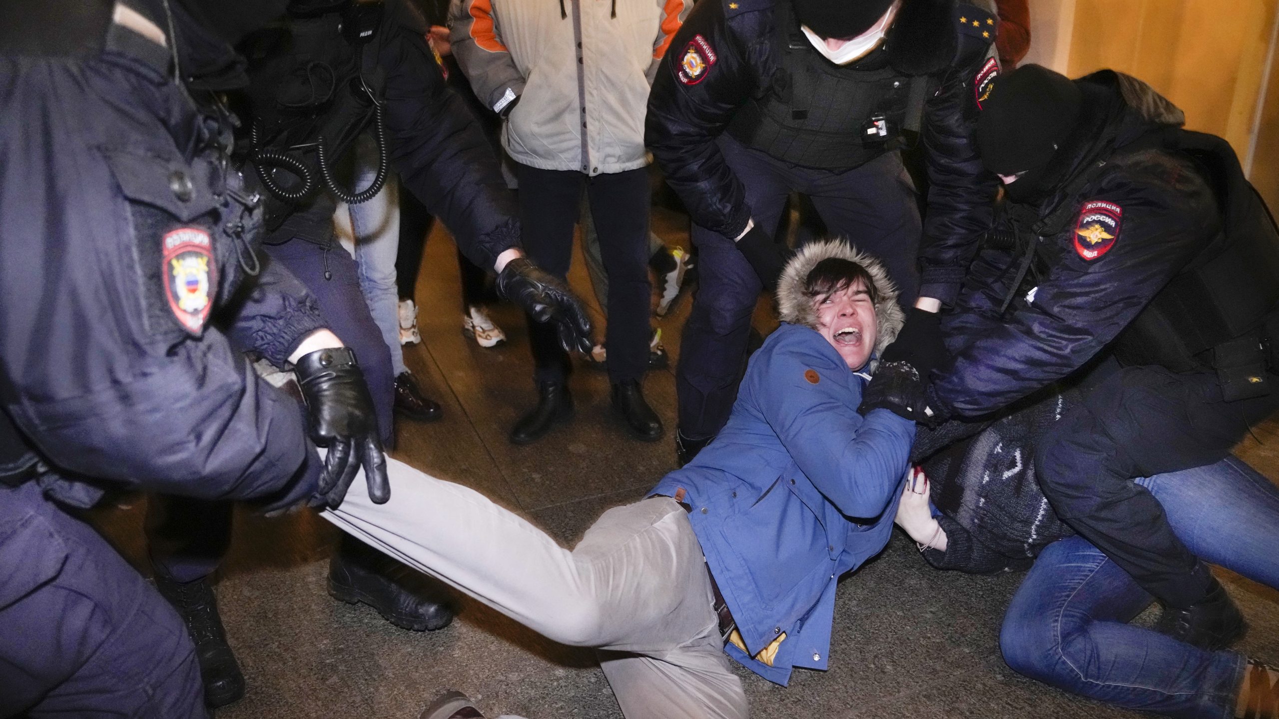Police officers detain demonstrators in St. Petersburg, Russia, Thursday, Feb. 24, 2022. Hundreds o...