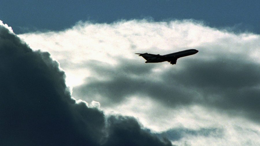 FILE - An airplane flies through the clouds in Salt Lake City. (Jeffrey D. Allred / Deseret News)...