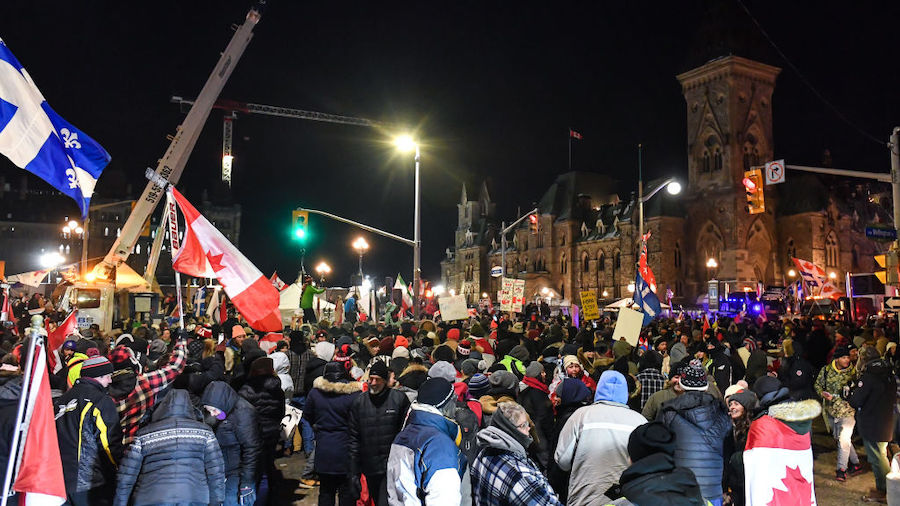Supporters against vaccines mandates continue to party into the night on February 5, 2022 in Ottawa...