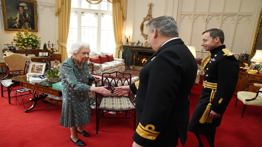 WINDSOR, ENGLAND - FEBRUARY 16: Queen Elizabeth II speaks with Rear Admiral James Macleod  (right) ...