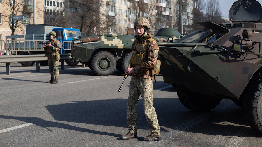 Ukrainian servicemen protect the checkpoint on February 25, 2022 in Kyiv, Ukraine. Russia began a l...