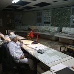 CHORNOBYL, UKRAINE - SEPTEMBER 29: Workers sit in the control room of reactor number two inside the former Chernobyl nuclear power plant on September 29, 2015 near Chornobyl, Ukraine. The Chernobyl plant is currently undergoing a decades-long decommissioning process of reactors one, two and three, which continued operation for years following the accident at reactor four. On April 26, 1986, technicians at Chernobyl conducting a test inadvertently caused reactor number four, which contained over 200 tons of uranium, to explode, flipping the 1,200 ton lid of the reactor into the air and sending plumes of highly radioactive particles and debris into the atmosphere in a deadly cloud that reached as far as western Europe. 32 people, many of them firemen sent to extinguish the blaze, died within days of the accident, and estimates vary from 4,000 to 200,000 deaths since then that can be attributed to illnesses resulting from Chernobyl's radioactive contamination. Today large portions of the inner and outer Chernobyl Exclusion Zone that together cover 2,600 square kilometers remain contaminated. A consortium of western companies is building a movable enclosure called the New Safe Confinement that will cover the reactor remains and its fragile sarcophagus in order to prevent further contamination.  (Photo by Sean Gallup/Getty Images)