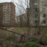 PRIPYAT, UKRAINE - APRIL 09:  A children's seesaw stands among former apartment buildings on April 9, 2016 in Pripyat, Ukraine. Pripyat, built in the 1970s as a model Soviet city to house the workers and families of the Chernobyl nuclear power plant, now stands abandoned inside the Chernobyl Exclusion Zone, a restricted zone contaminated by radiation from the 1986 meltdown of reactor number four at the nearby Chernobyl plant in the world's worst civilian nuclear accident that spewed radiaoactive fallout across the globe. Authorities evacuated approximately 43,000 people from Pripyat in the days following the disaster and the city, with its high-rise apartment buildings, hospital, shops, schools, restaurants, cultural center and sports facilities, has remained a ghost-town ever since. The world will soon commemorate the 30th anniversary of the April 26, 1986 Chernobyl disaster. Today tour operators bring tourists in small groups to explore certain portions of the exclusion zone.  (Photo by Sean Gallup/Getty Images)