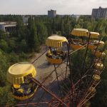 PRIPYAT, UKRAINE - AUGUST 19:  In this aerial view, a ferris wheel stands in the ghost town of Pripyat not far from the Chernobyl nuclear power plant on August 19, 2017 in Pripyat, Ukraine. On April 26, 1986 reactor number four exploded after a safety test went wrong, spreading radiation over thousands of square kilometers in different directions. The nearby town of Pripyat, which had a population of approxiamtely 40,000 and housed the plant workers and their families, was evacuated and has been abandoned ever since.  (Photo by Sean Gallup/Getty Images)
