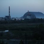 CHORNOBYL, UKRAINE - AUGUST 17:  The new, giant enclosure that covers devastated reactor number four at the Chernobyl nuclear power plant stands at twilight on August 17, 2017 near Chornobyl, Ukraine. An estimated 900 stray dogs live in the CHORNOBYL exclusion zone, many of them likely the descendants of dogs left behind following the mass evacuation of residents in the aftermath of the 1986 nuclear disaster at CHORNOBYL. Volunteers, including veterinarians and radiation experts from around the world, are participating in an initiative called The Dogs of CHORNOBYL, launched by the non-profit Clean Futures Fund. Participants capture the dogs, study their radiation exposure, vaccinate them against parasites and diseases including rabies, tag the dogs and release them again into the exclusion zone. Some dogs are also being outfitted with special collars equipped with radiation sensors and GPS receivers in order to map radiation levels across the zone.  (Photo by Sean Gallup/Getty Images)