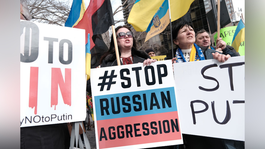 Dozens of pro-Ukrainian activists and Ukrainian Americans rally outside of the United Nations (UN) ...
