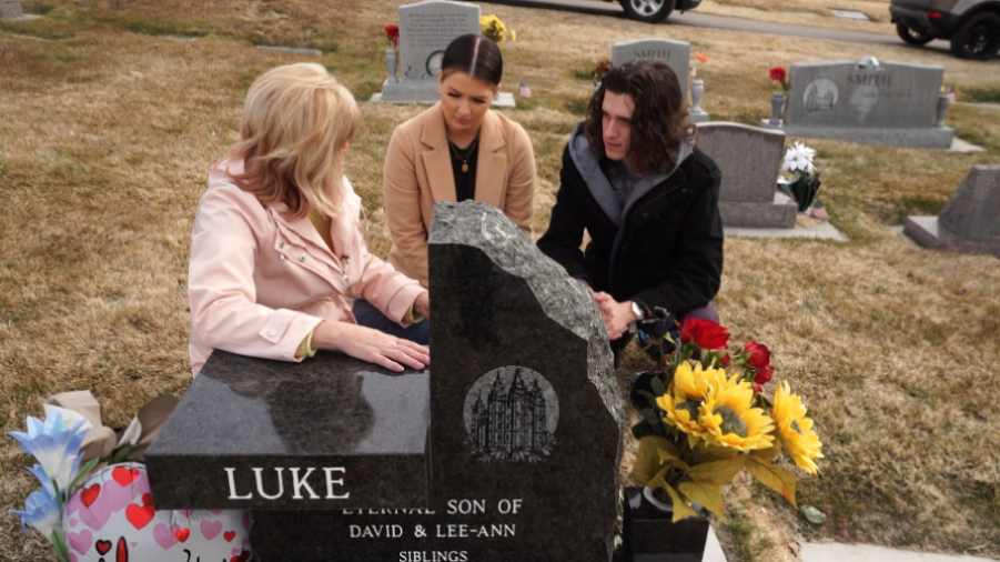 Lee-Ann Luke gathers with two of her ten children, Ruth and Zane, at the headstone of her youngest ...