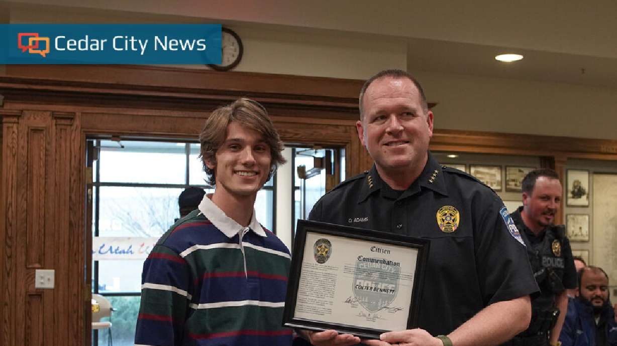 Cedar City Police Department's Chief of Police, Darin Adams, presents Colter Bennett a citizen comm...