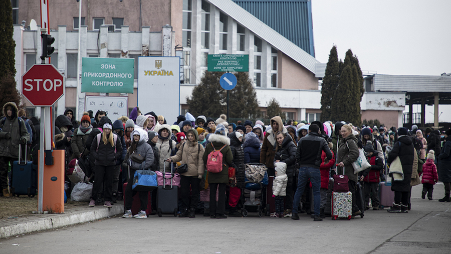 Refugees at the on the Ukrainian side of the Krakovets Polish border crossing on March 4, 2022. (WF...