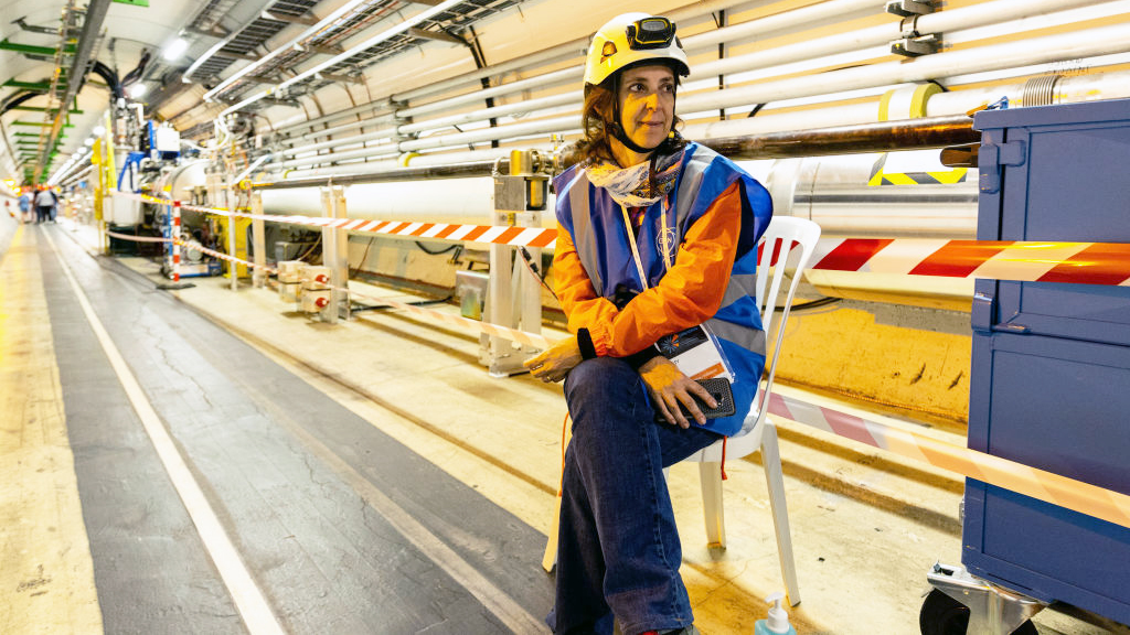 FILE PHOTO - A volunteer is seen inside the LHC tunnels during the Open Days at the CERN particle p...