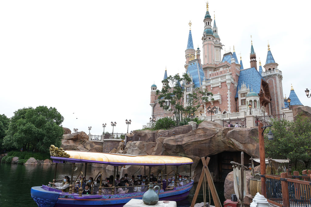 SHANGHAI, CHINA - JUNE 16:  Tourists visit Shanghai Disneyland during the resort's 5th anniversary ...