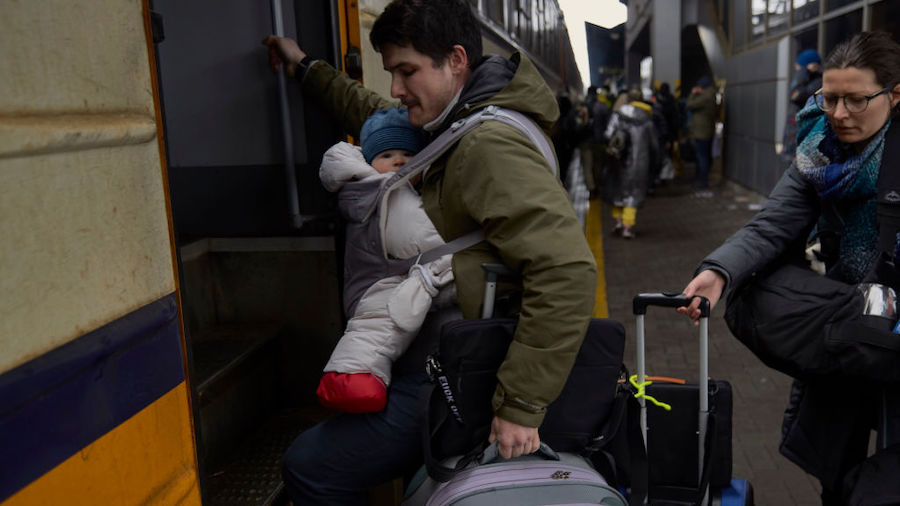 People board a train to evacuate Kyiv to western cities on March 3, 2022 in Kyiv, Ukraine. Over a m...