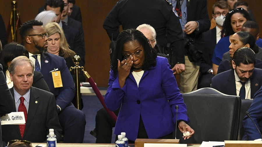 WASHINGTON, DC - MARCH 21: Supreme Court nominee Judge Ketanji Brown Jackson wipes her eye after be...