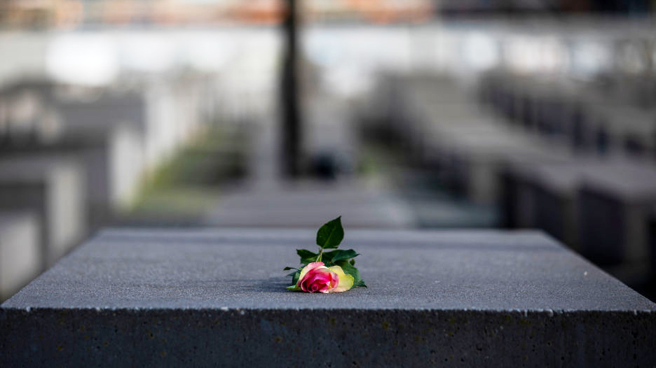 FILE -- A rose is placed on the Holocaust Memorial on the International Holocaust Remembrance Day o...