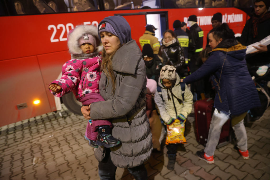 KORCZOWA, POLAND - FEBRUARY 28: A woman arrives with her family from Ukraine at a temporary shelter...