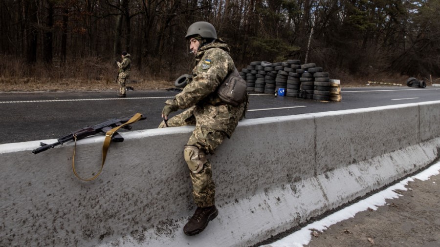 KYIV, UKRAINE - MARCH 08: A member of the Ukrainian military jumps a road divider at a forward posi...