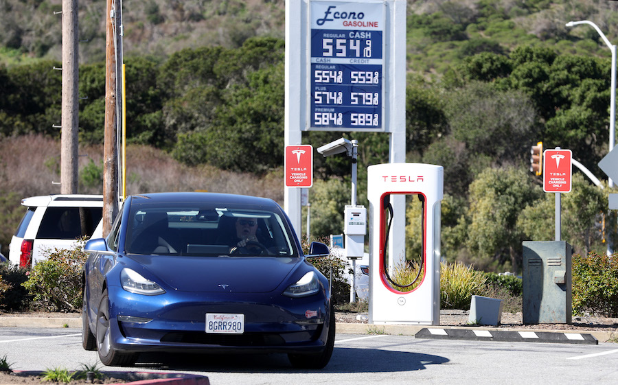 A Tesla car leaves  a Supercharger after recharging its battery on March 10, 2022 in San Bruno, Cal...