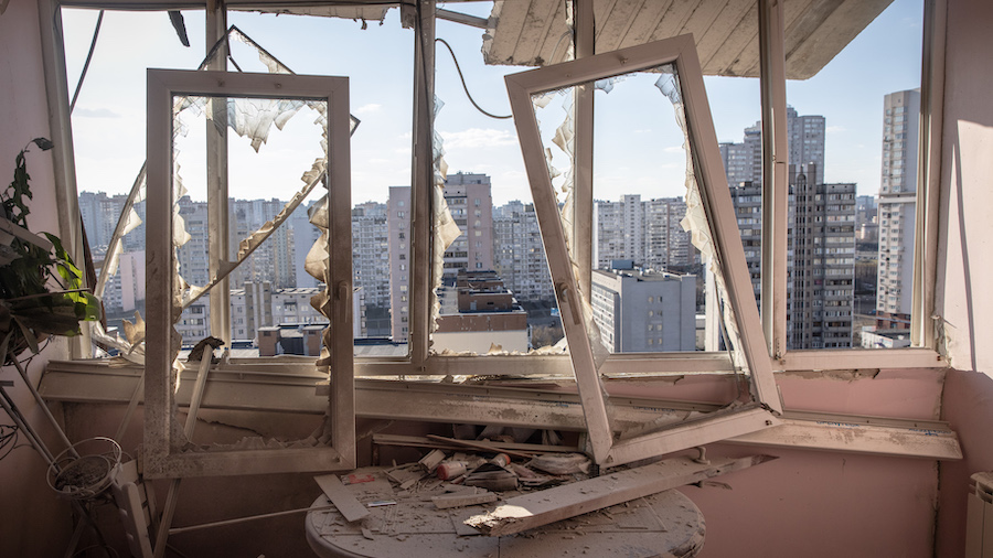 Damage is seen in the kitchen of an apartment at an apartment block that was hit by the debris of a...