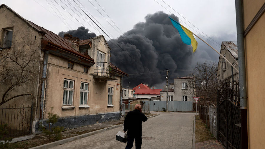 Smoke pours from a fire at an industrial facility after Russian military attack in the area on Marc...