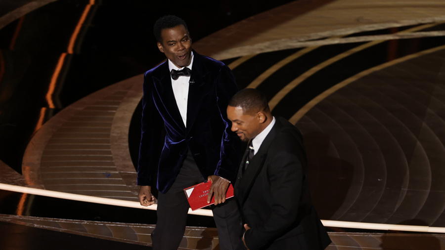 HOLLYWOOD, CALIFORNIA - MARCH 27: (L-R) Chris Rock and Will Smith are seen onstage during the 94th ...
