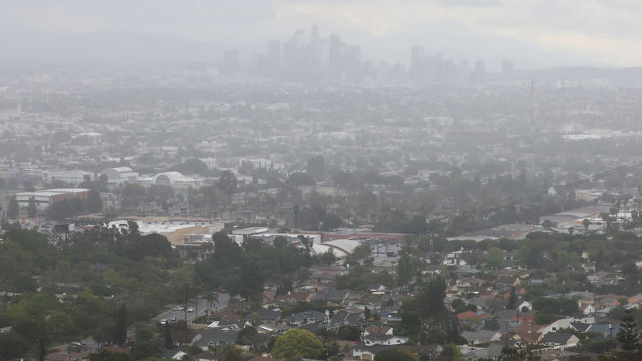 Rain falls over downtown Los Angeles (Top) during a late season storm on March 28, 2022 in Los Ange...