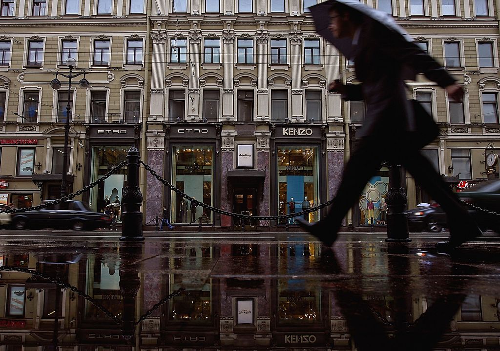 FILE: ST. PETERSBURG, RUSSIA - JULY 17:  Shoppers walk past exclusive boutiques in the Nevsky prosp...