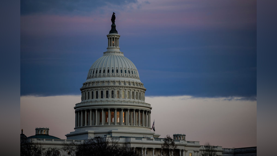 The U.S. Capitol building is seen at sunset ahead of President Joe Biden's first State of the Union...