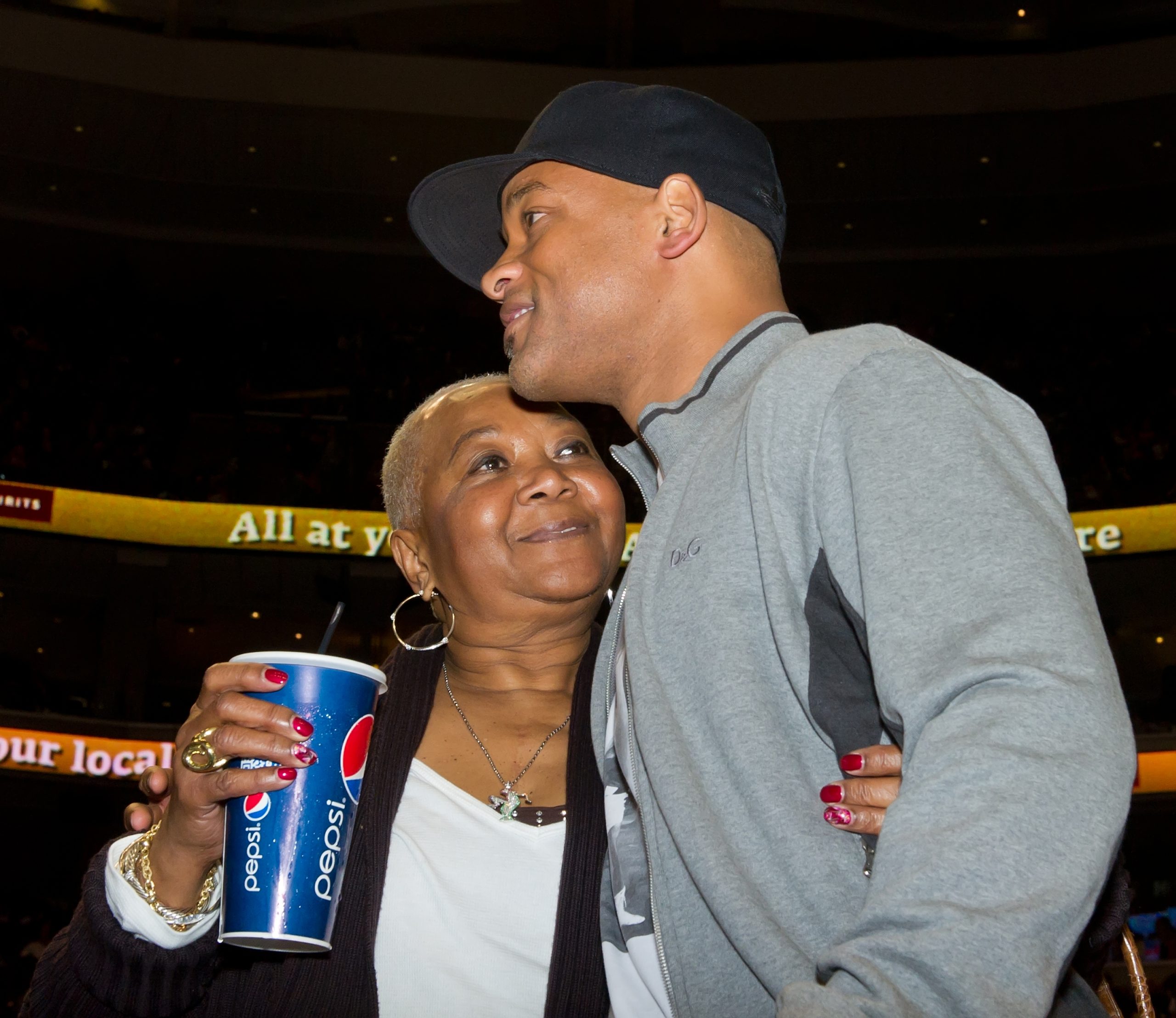 PHILADELPHIA, PA - MARCH 16:  Will Smith (R) and his mother Carolyn Smith attend the Miami Heat vs....