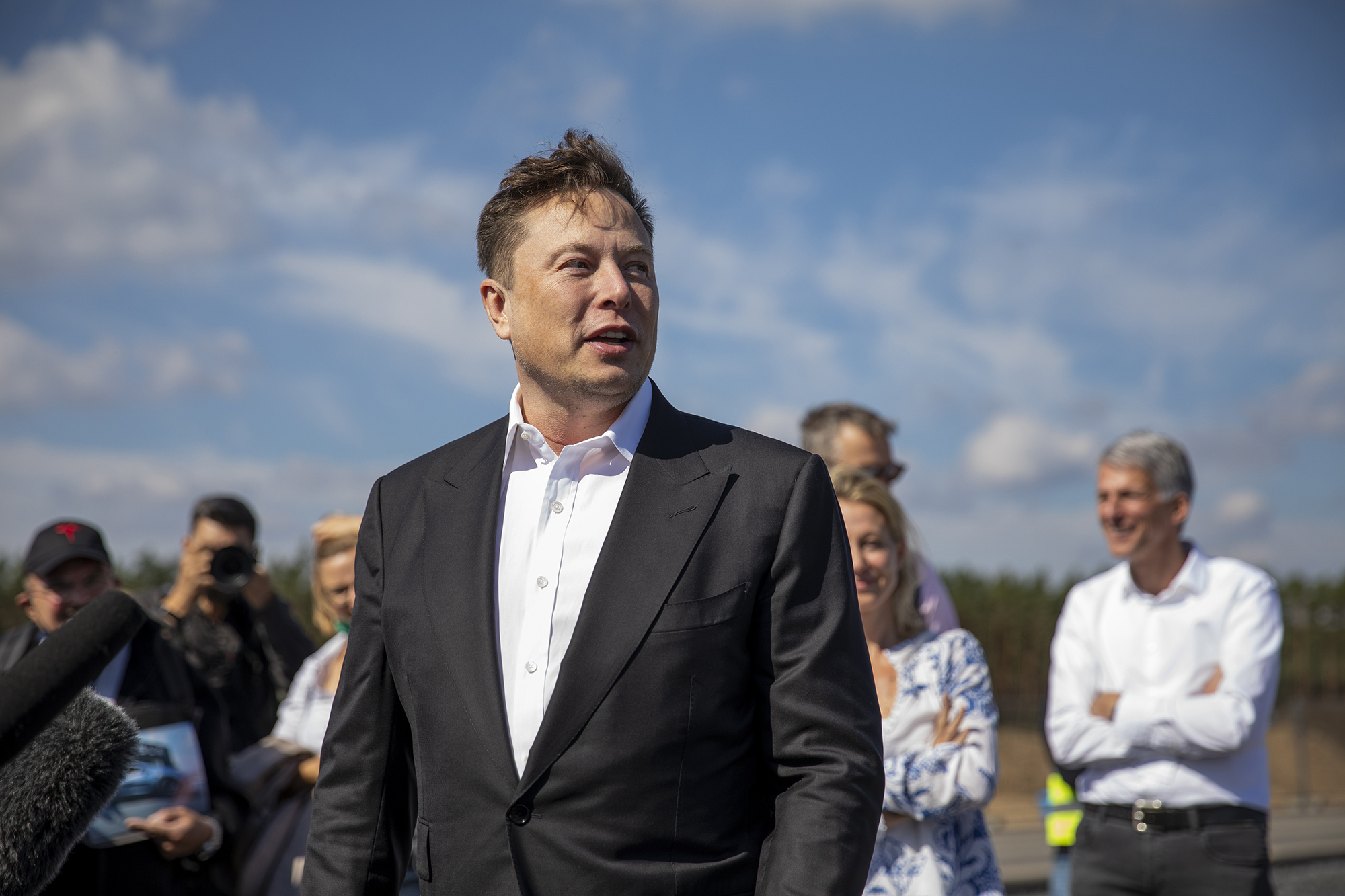 GRUENHEIDE, GERMANY - SEPTEMBER 03: Tesla head Elon Musk talks to the press as he arrives to to hav...