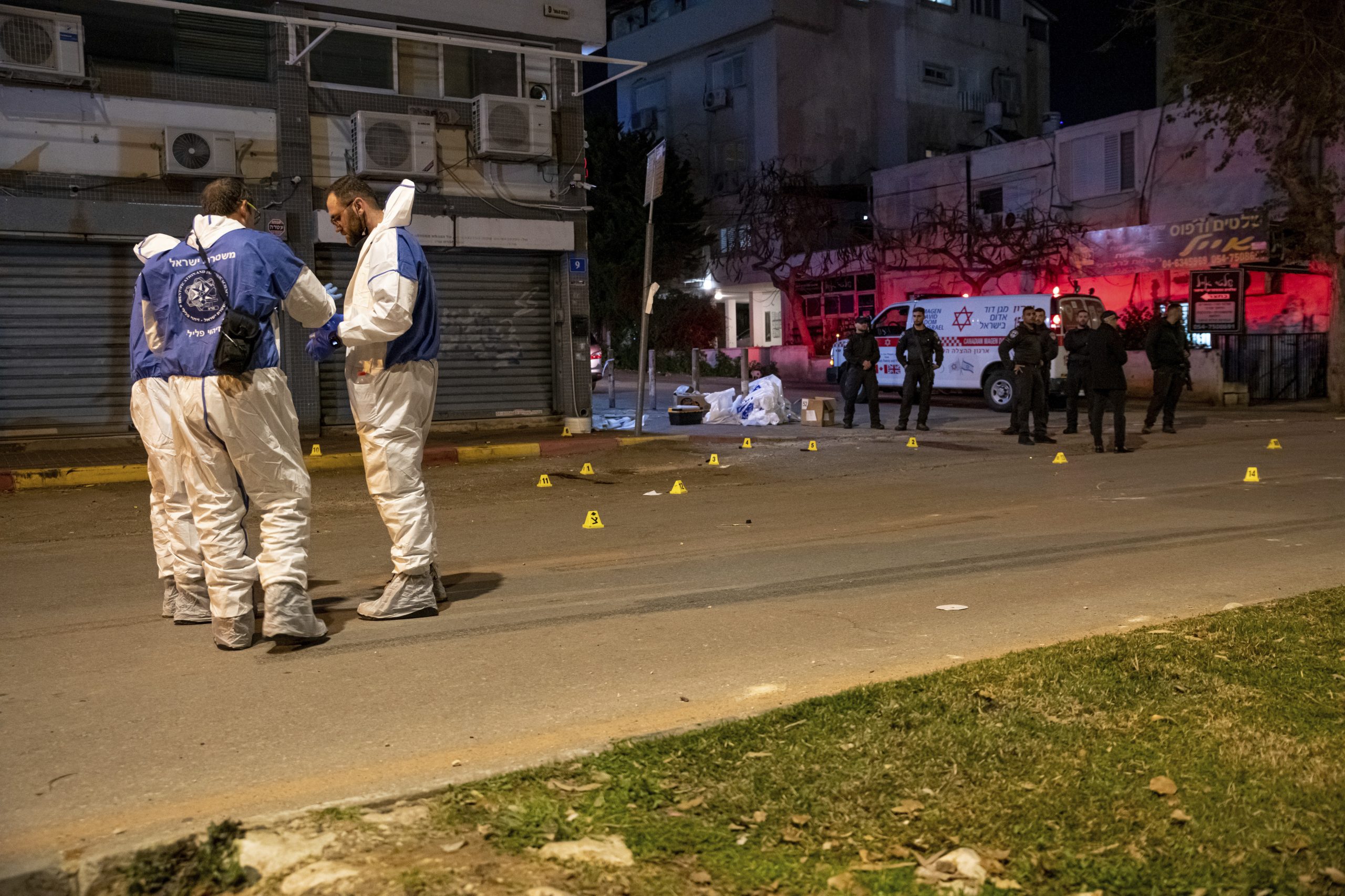 Policeman and forensics next to the victims shooting scene. Two Israeli border police soldiers were...