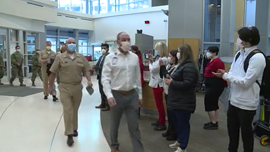University of Utah hosteda "clap out" ceremony Wednesday as military medical personnel from the Nav...