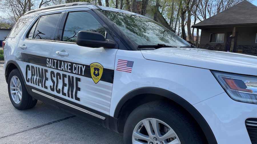 A Salt Lake City Police Department crime scene vehicle near the area where a woman was found bleedi...