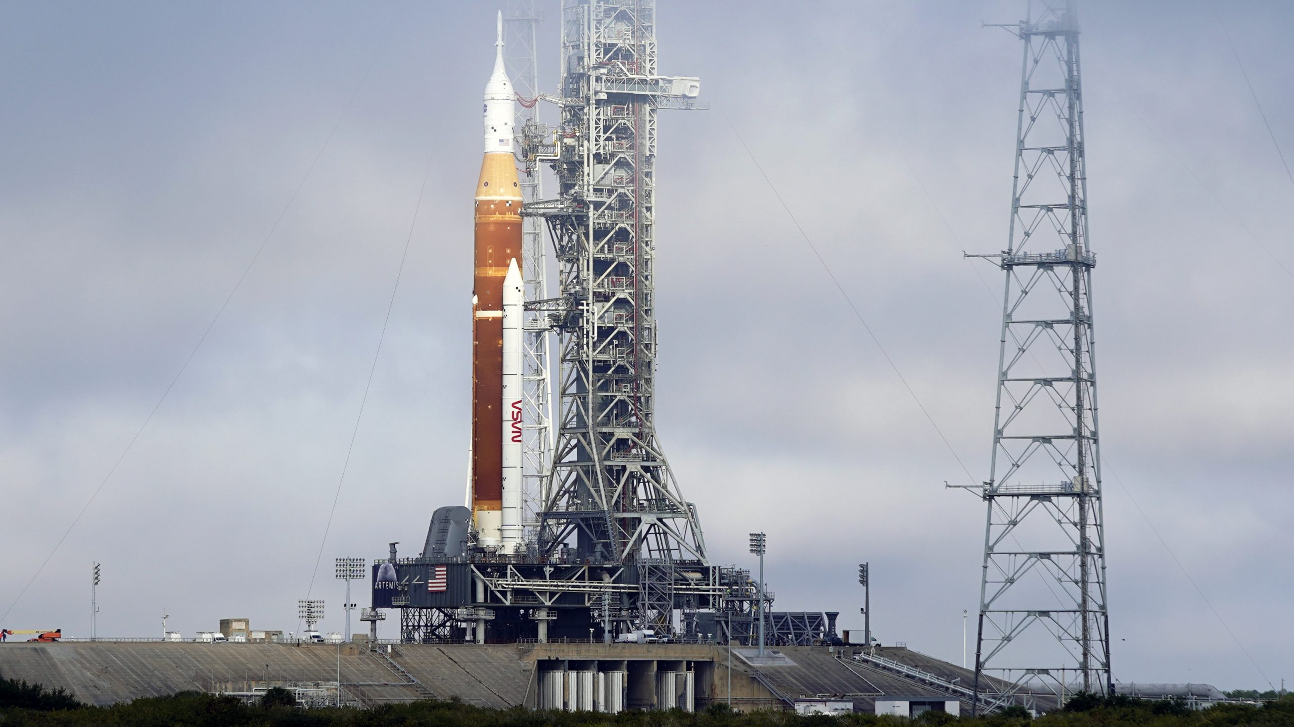FILE -The NASA Artemis rocket with the Orion spacecraft aboard stands on pad 39B at the Kennedy Spa...