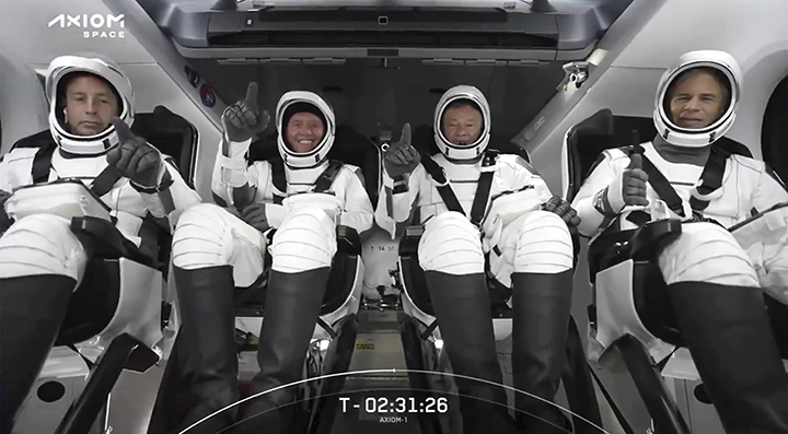 HOLD FOR STORY FILE - This photo provided by SpaceX shows the SpaceX crew seated in the Dragon spac...