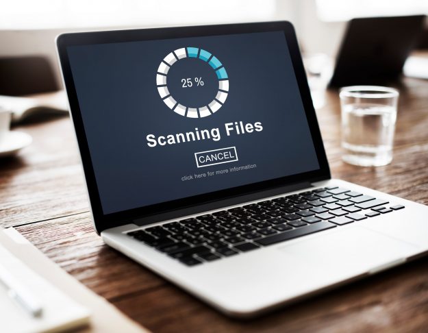 laptop showing progress bar scanning files