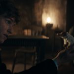 (L-R) EDDIE REDMAYNE as Newt Scamander with a baby Niffler and VICTORIA YEATES as Bunty  in a scene from "FANTASTIC BEASTS: THE SECRETS OF DUMBLEDORE,” a Warner Bros. Pictures release.