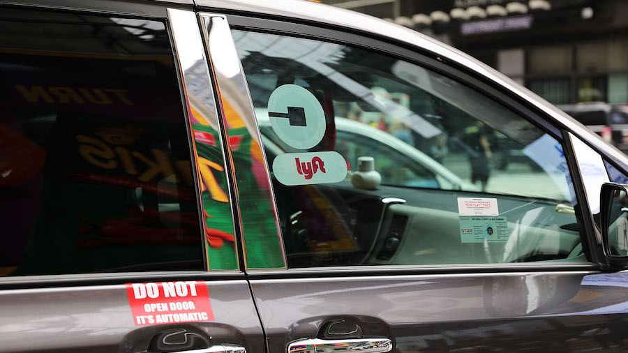 FILE PHOTO A Lyft ride hailing vehicle moves through traffic in Manhattan on July 30, 2018 in New Y...