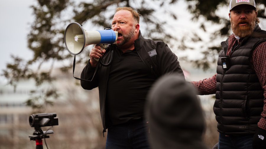 FILE: Alex Jones, the founder of right-wing media group Infowars, addresses a crowd of pro-Trump pr...