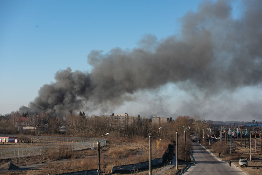 FILE: LVIV, UKRAINE - MARCH 18: Smoke is seen above buildings close to the airport on March 18, 202...