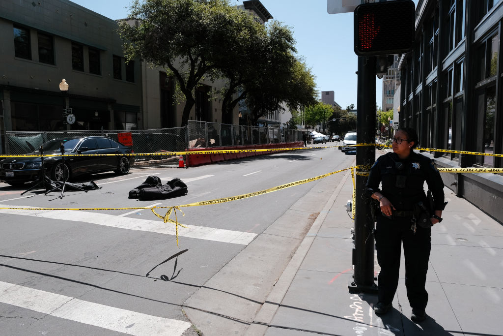 SACRAMENTO, CALIFORNIA  APRIL 03:  Police work the scene on the corner of 10th and J street after a...
