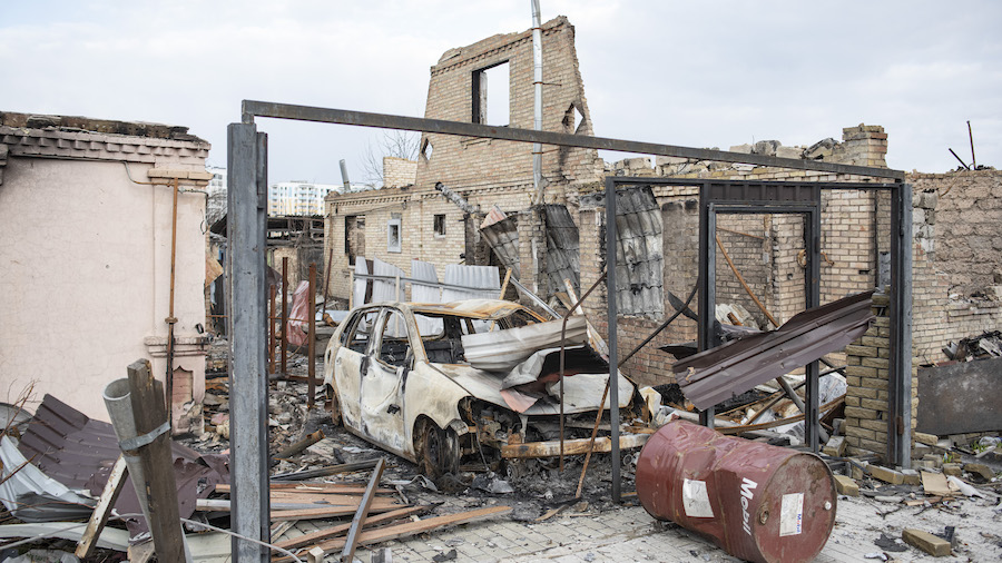 A destroyed car is seen amid the ruins of a building on April 4, 2022 in Bucha, Ukraine. The Ukrain...