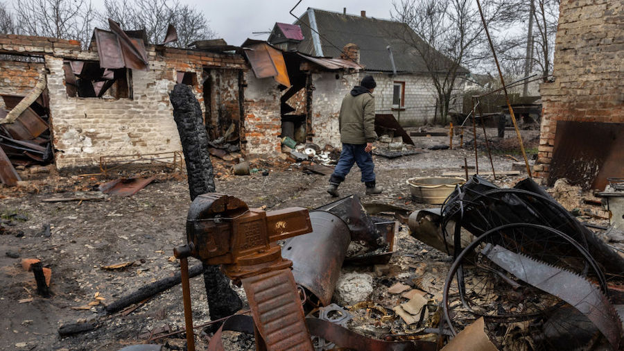 Viktor , 58, walks through the rubble of his and his neighbor's homes on April 22, 2022 in Andrivka...