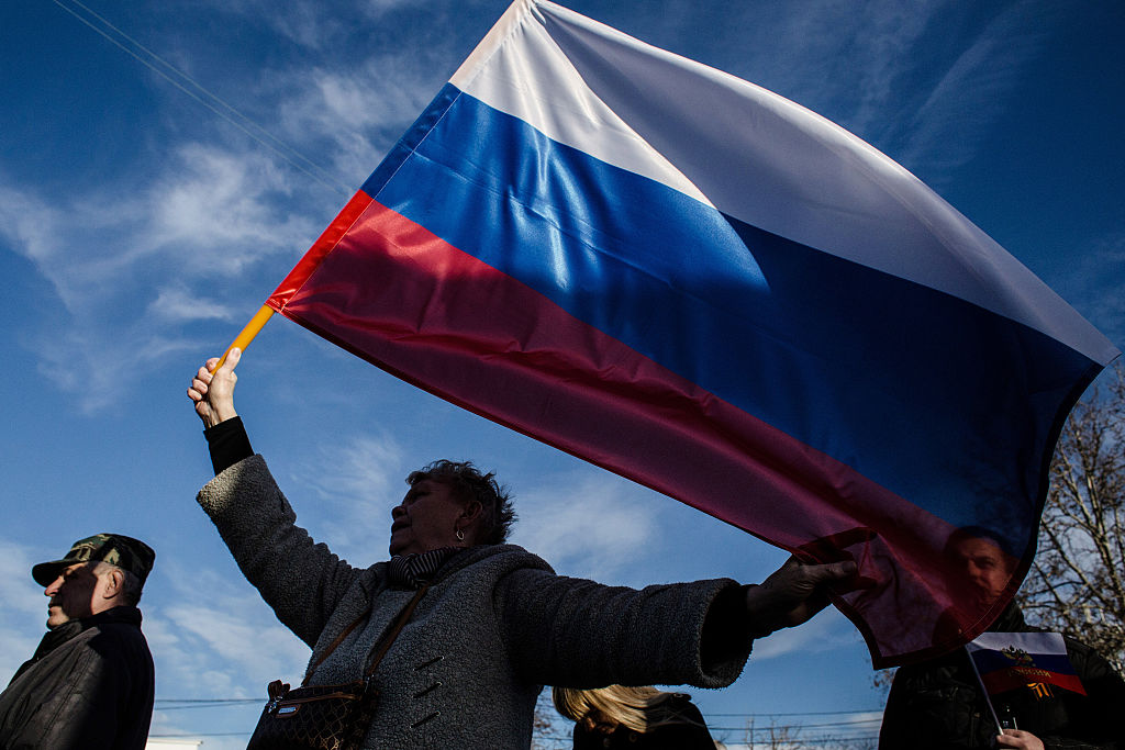 FILE: SEVASTOPOL, CRIMEA - MARCH 16:  Crimeans wave Russian flags as they celebrate the first anniv...