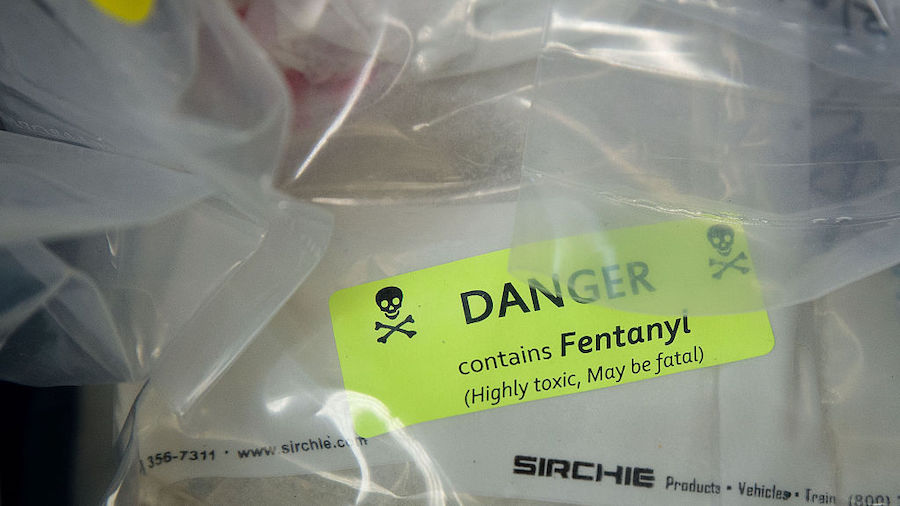Bags of heroin, some laced with fentanyl, are displayed before a press conference regarding a major...