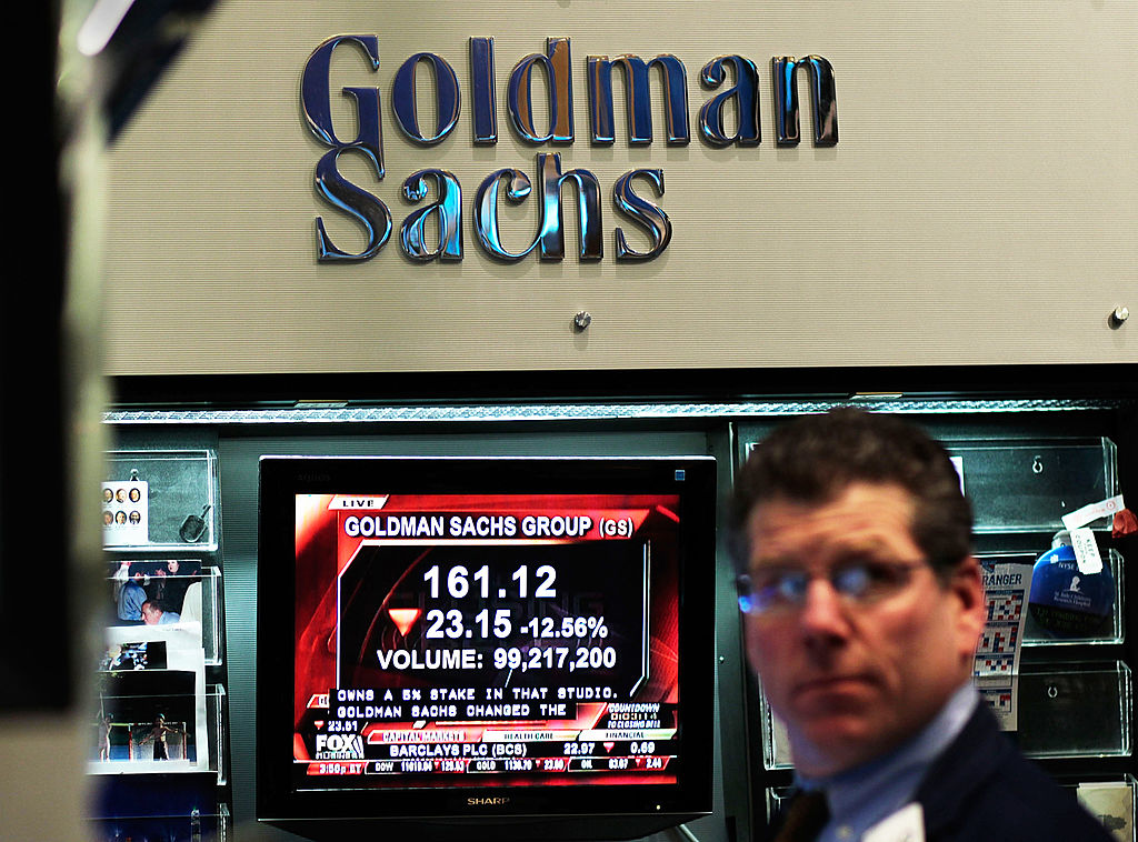 NEW YORK - APRIL 16:  A financial professional works in the Goldman Sachs booth on the floor of the...