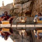 ‘Nick Cage’ (Nicolas Cage, left) enjoying a welcome drink on ’Javi Gutierezz’s’ (Pedro Pascal, right) compound in Mallorca, Spain.