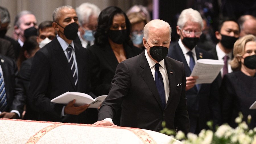 President Joe Biden pays his respects at the casket of former Secretary of State Madeleine Albright...