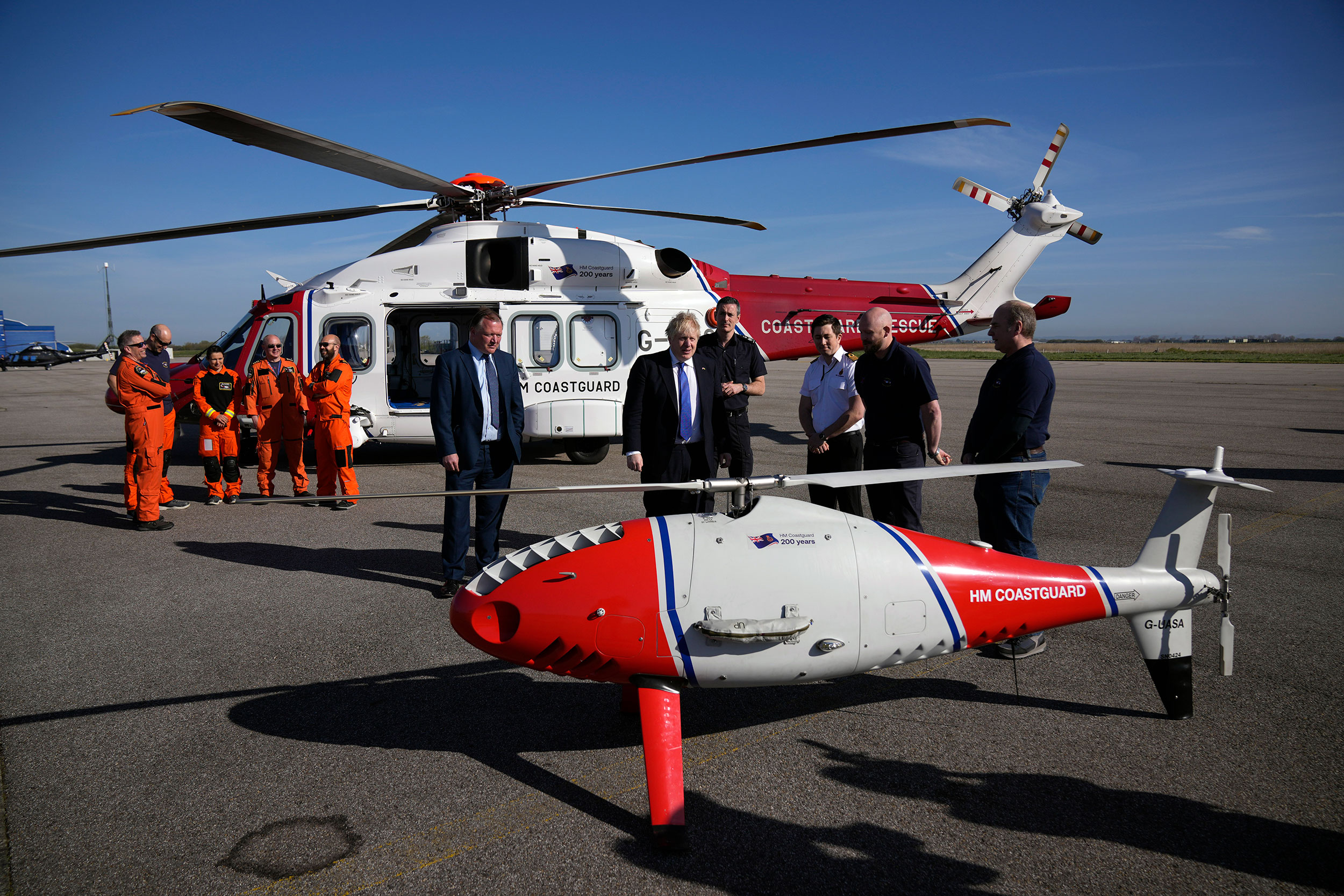 British Prime Minister Boris Johnson looks at a Coastguard drone for surveillance and rescue of mig...
